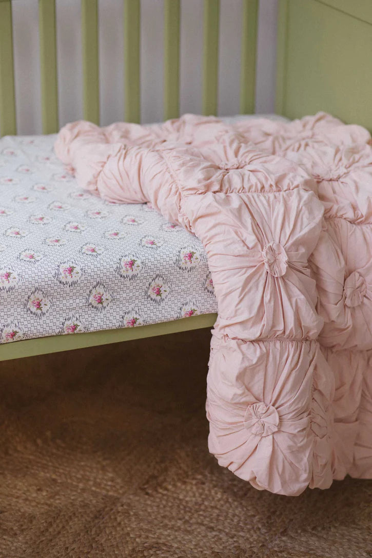 Lazybones Cot quilt Rosette Tuscan Pink